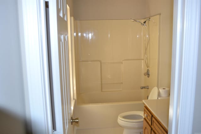 full bathroom featuring toilet, vanity, and bathing tub / shower combination