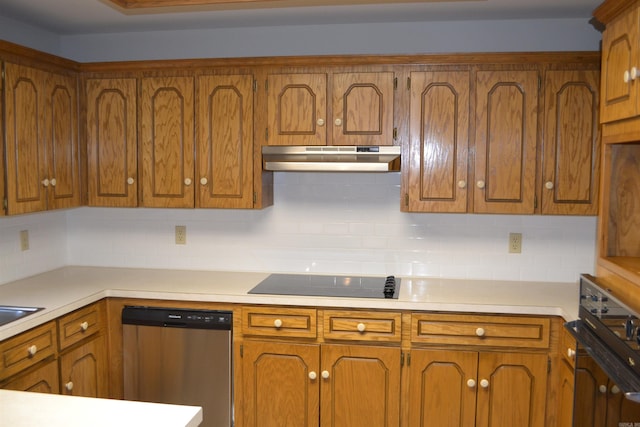 kitchen featuring black appliances and tasteful backsplash