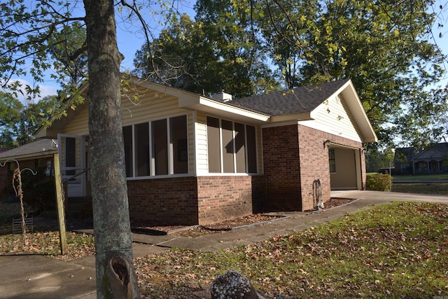 view of property exterior with a garage