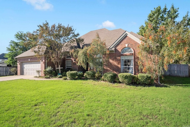 view of front of home featuring a garage and a front lawn