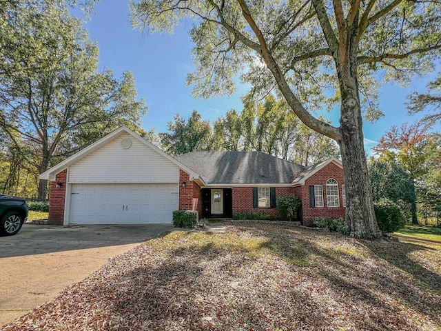 ranch-style home featuring a garage