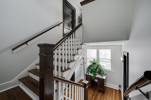 stairs with wood-type flooring