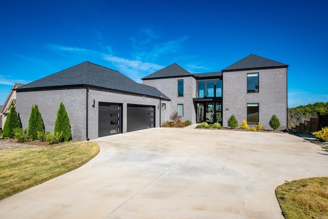 view of front of property featuring a garage and french doors