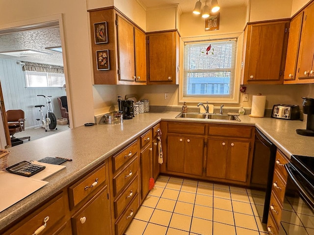 kitchen with a textured ceiling, black appliances, sink, and light tile patterned floors