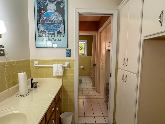 bathroom featuring vanity, tile walls, and tile patterned flooring