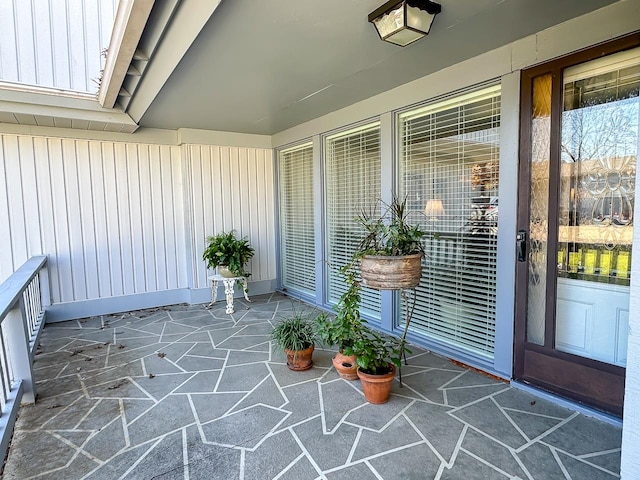 view of exterior entry featuring a porch