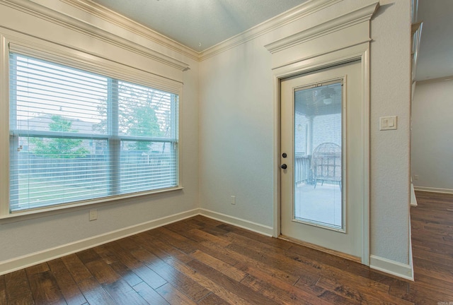 entryway with crown molding and dark hardwood / wood-style floors