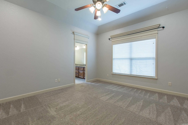 carpeted spare room with ceiling fan