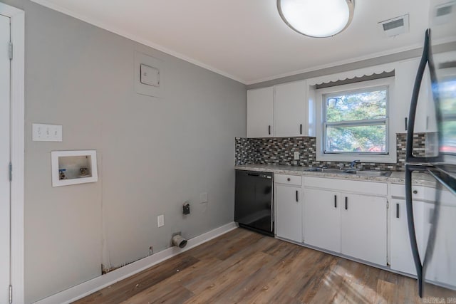 kitchen with white cabinetry, sink, ornamental molding, dark wood-type flooring, and black dishwasher