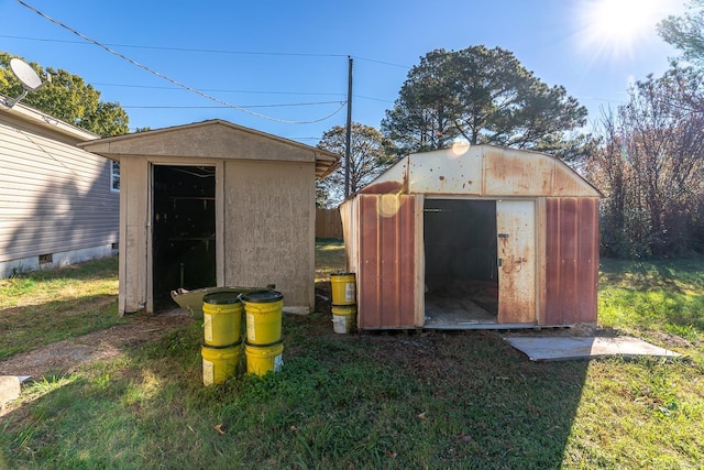 view of outbuilding featuring a yard