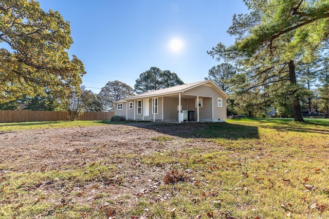 exterior space with a yard and covered porch