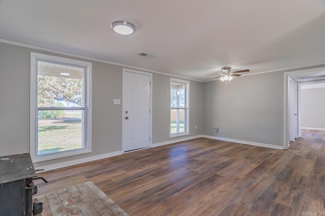 foyer with ornamental molding, dark hardwood / wood-style flooring, and ceiling fan