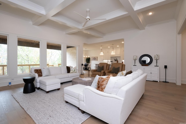 living room featuring beamed ceiling, wood-type flooring, and coffered ceiling