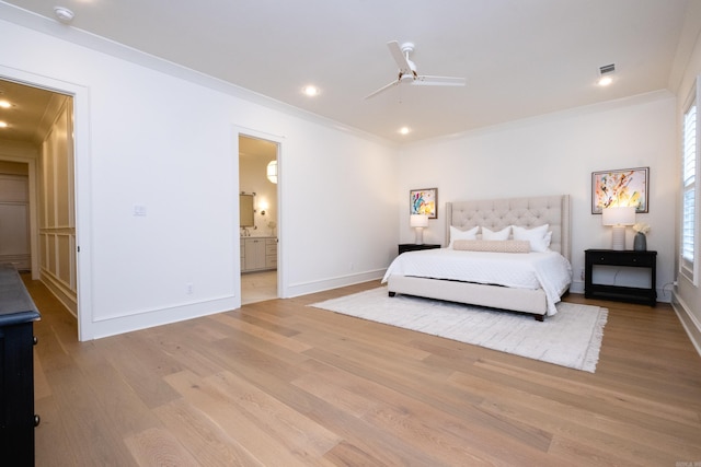 bedroom with connected bathroom, ornamental molding, ceiling fan, and light hardwood / wood-style flooring