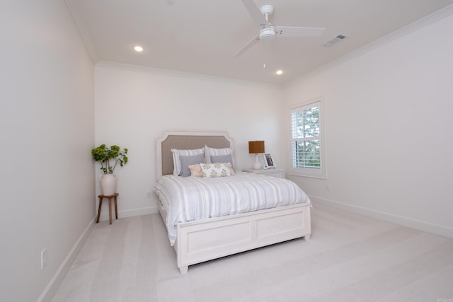 bedroom with ceiling fan, crown molding, and light colored carpet