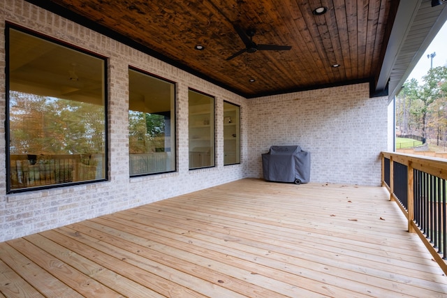 deck featuring a grill and ceiling fan