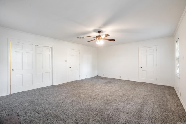 unfurnished bedroom with multiple closets, carpet flooring, ceiling fan, and crown molding