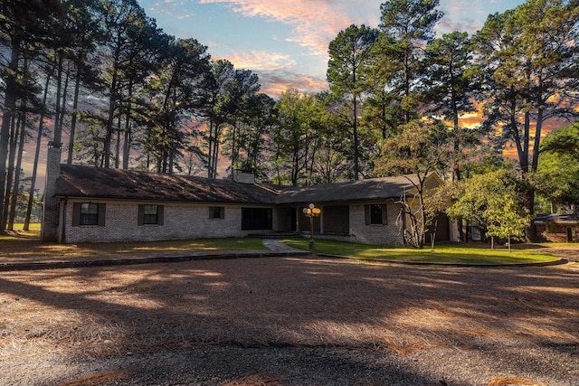 single story home featuring a yard