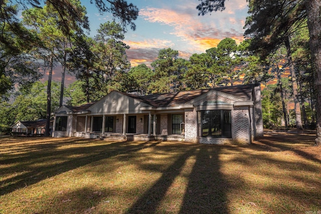 view of front of property with a lawn