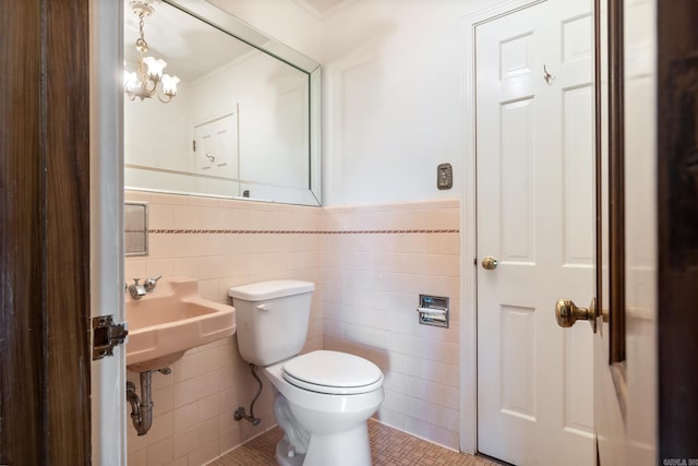 bathroom featuring tile walls, tile patterned flooring, and toilet