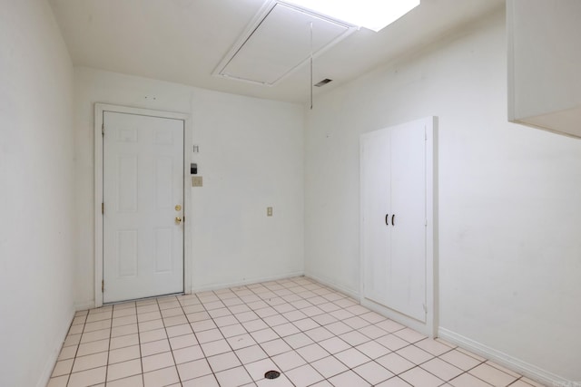 empty room with light tile patterned floors