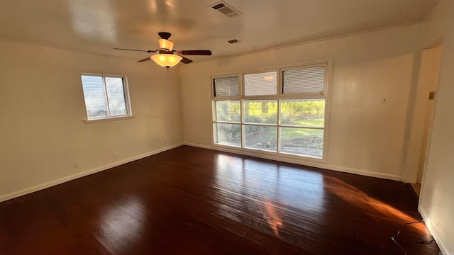 unfurnished room with dark hardwood / wood-style floors and ceiling fan