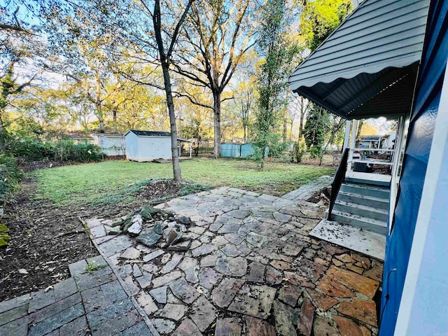 view of patio / terrace featuring a storage unit