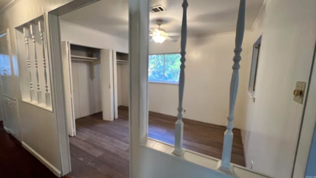 unfurnished bedroom featuring dark hardwood / wood-style floors and ceiling fan