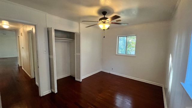 unfurnished bedroom with a closet, ceiling fan, and dark wood-type flooring