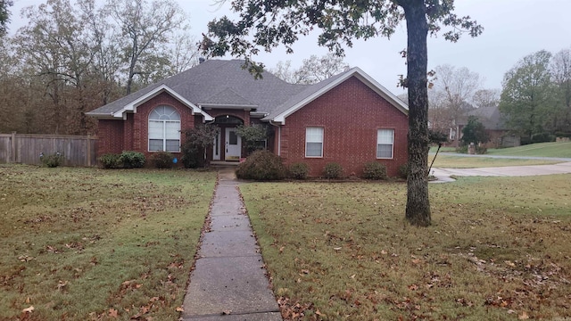 ranch-style house with a front lawn