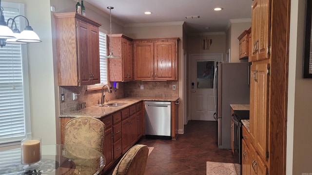 kitchen with decorative backsplash, light stone counters, stainless steel appliances, sink, and decorative light fixtures