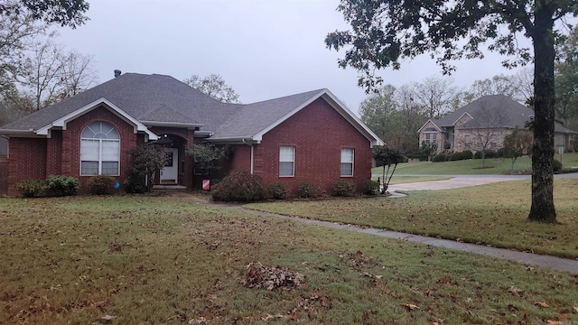 ranch-style home with a front yard