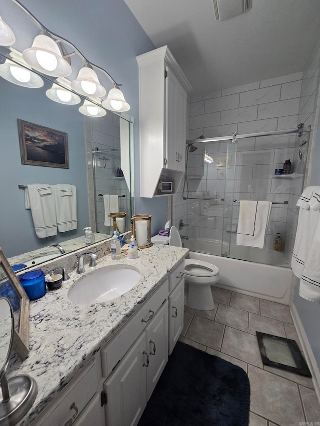 full bathroom featuring tile patterned flooring, bath / shower combo with glass door, lofted ceiling, toilet, and vanity