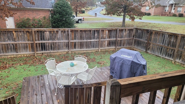 wooden terrace with area for grilling