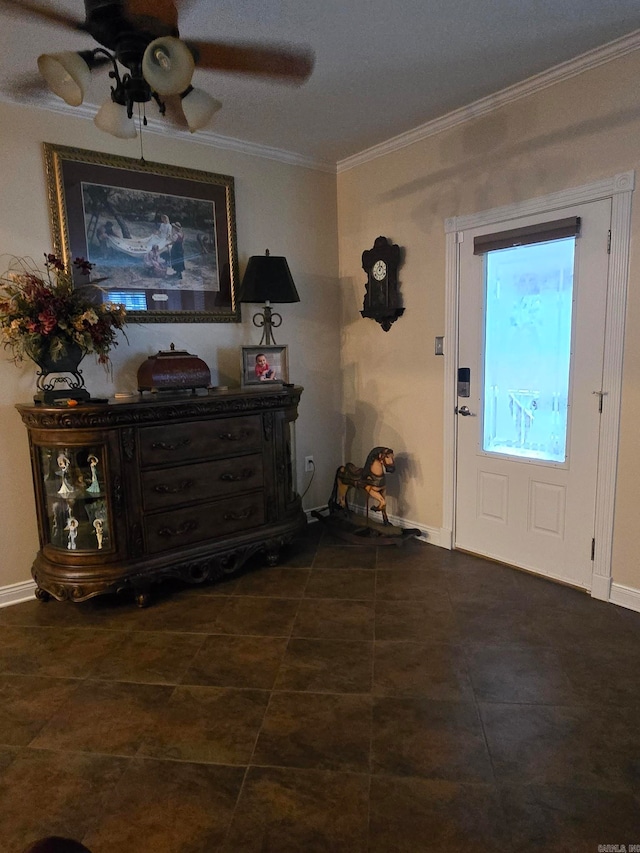 foyer with ceiling fan and ornamental molding