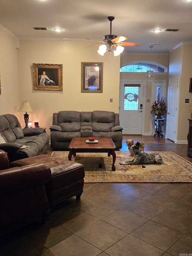 tiled living room featuring ceiling fan and ornamental molding