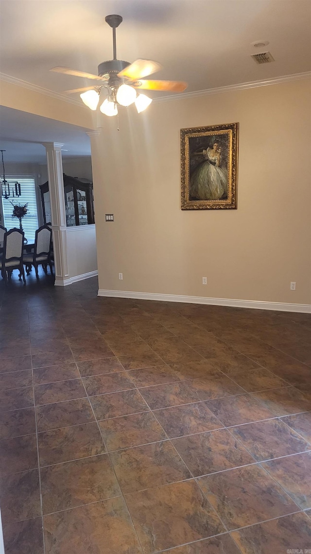 unfurnished room with ceiling fan and crown molding