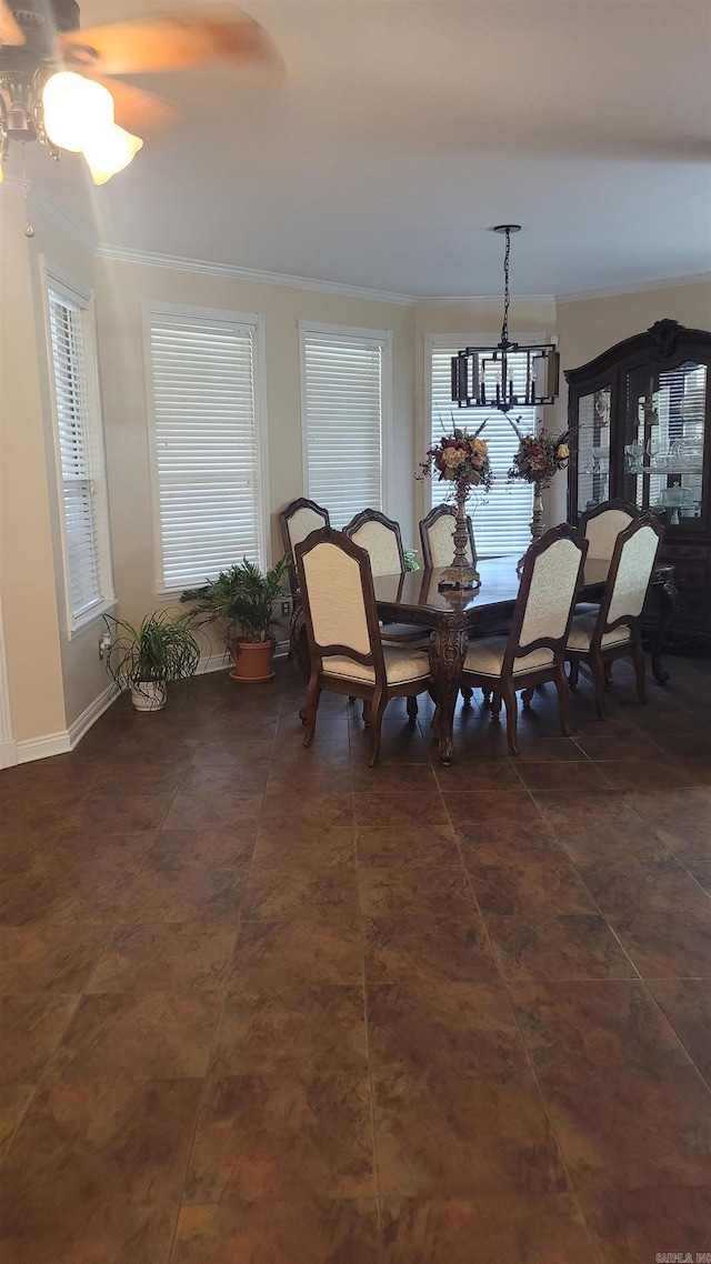 dining area with ceiling fan with notable chandelier and ornamental molding