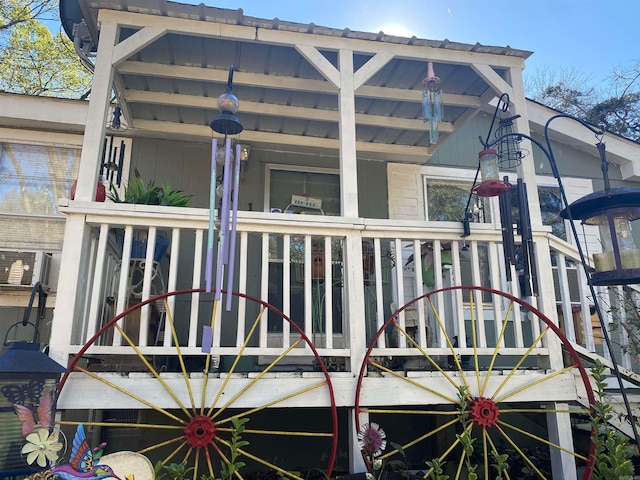 rear view of house featuring cooling unit