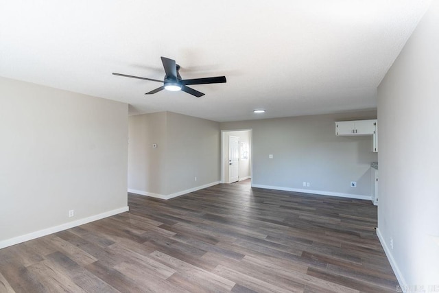 unfurnished room with dark wood-type flooring and ceiling fan