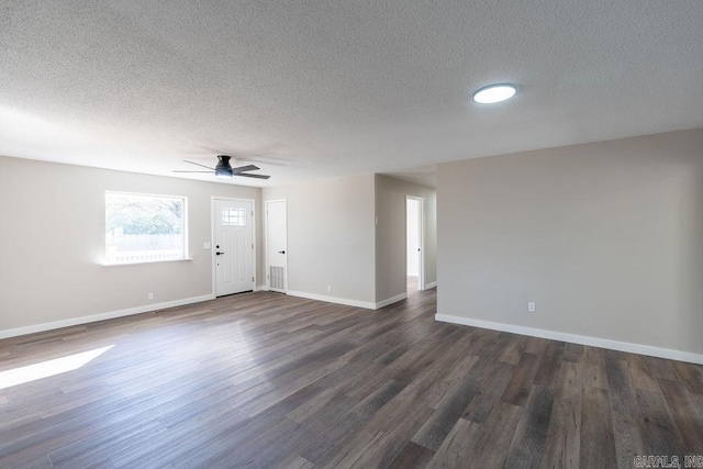 interior space with dark wood-type flooring, ceiling fan, and a textured ceiling