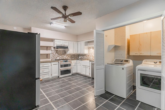 kitchen featuring appliances with stainless steel finishes, decorative backsplash, white cabinets, independent washer and dryer, and ceiling fan