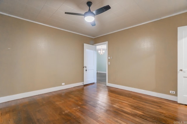 spare room featuring wood-type flooring, ceiling fan with notable chandelier, and crown molding