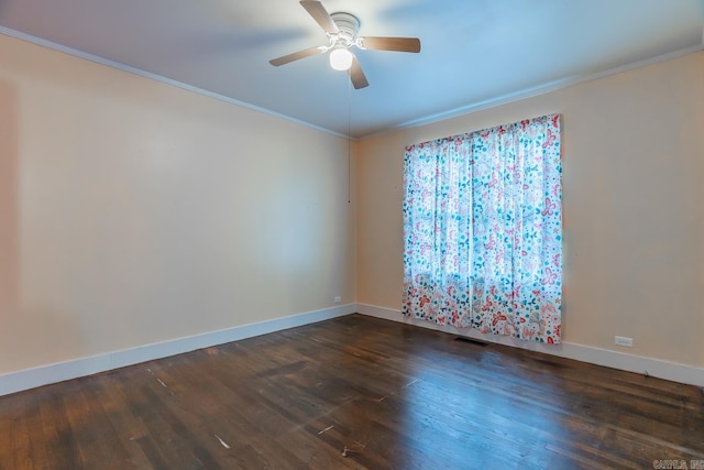 spare room with ornamental molding, ceiling fan, and dark hardwood / wood-style floors