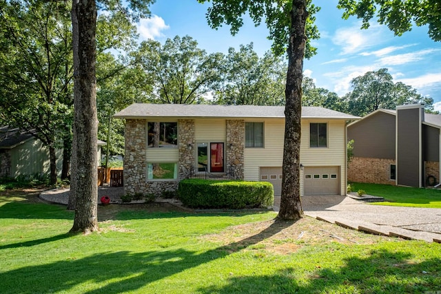 bi-level home with a front lawn and a garage