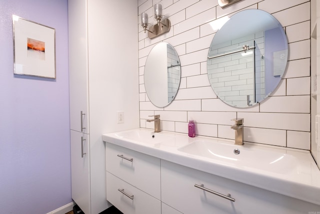 bathroom with vanity and tasteful backsplash