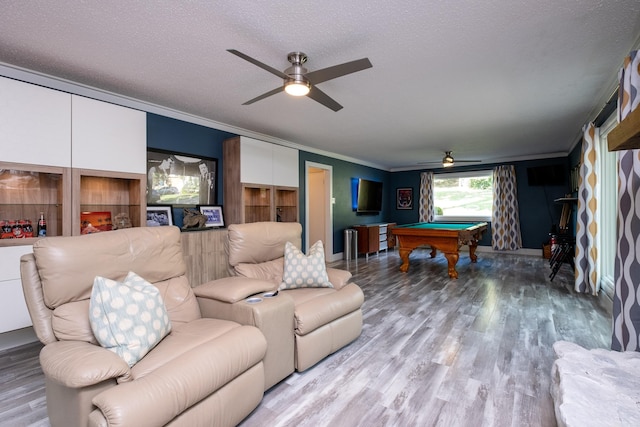 living room featuring pool table, ceiling fan, and crown molding