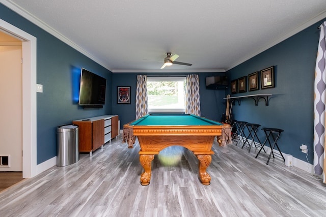 game room with hardwood / wood-style floors, ceiling fan, pool table, and crown molding