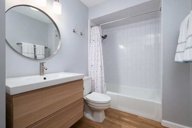 full bathroom featuring toilet, shower / tub combo, vanity, and hardwood / wood-style floors