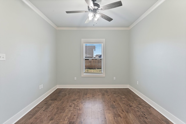 empty room with dark hardwood / wood-style flooring, ceiling fan, and crown molding